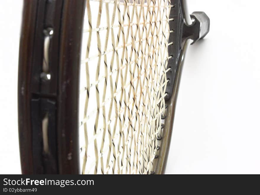 Tennis racket of brown color on a white background