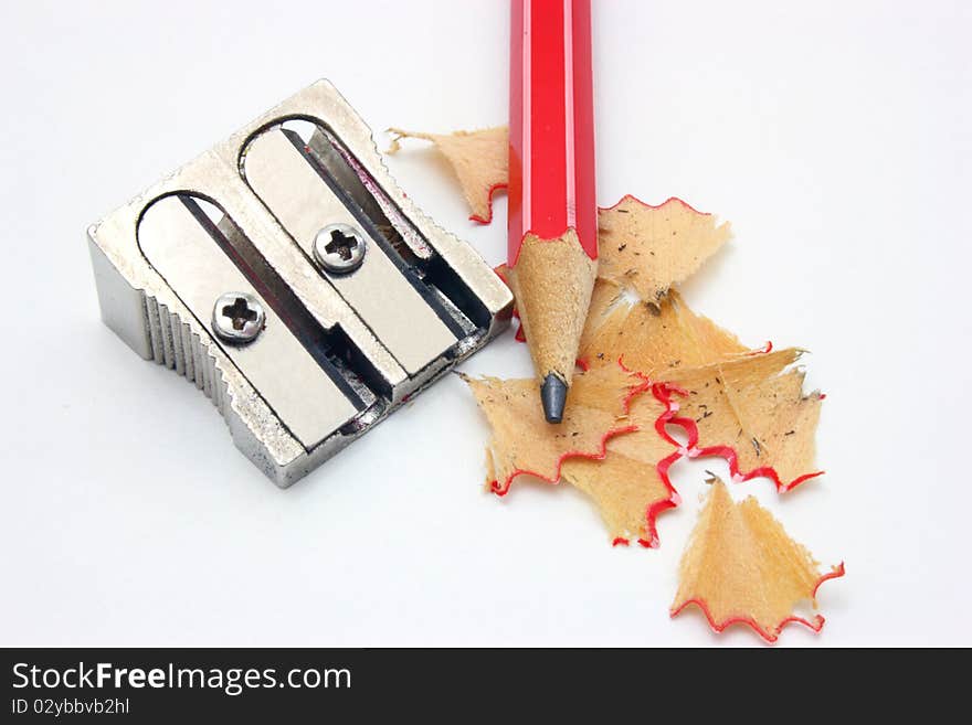 Shot of eraser, pencil and pencil metal double sharpener on a white background. Shot of eraser, pencil and pencil metal double sharpener on a white background