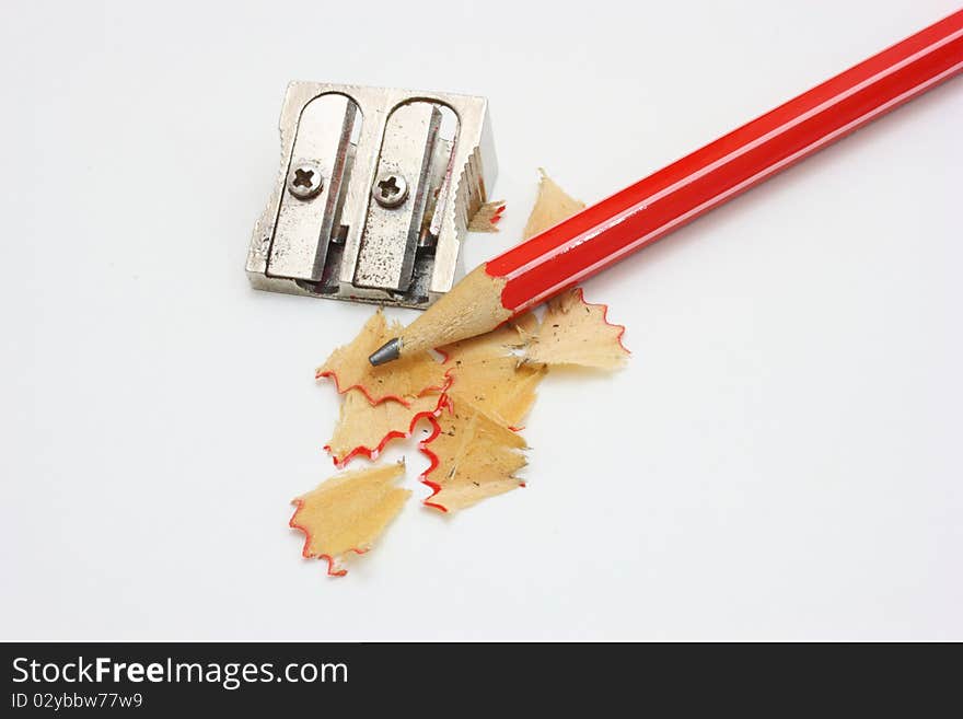 Shot of eraser, pencil and pencil metal double sharpener on a white background. Shot of eraser, pencil and pencil metal double sharpener on a white background