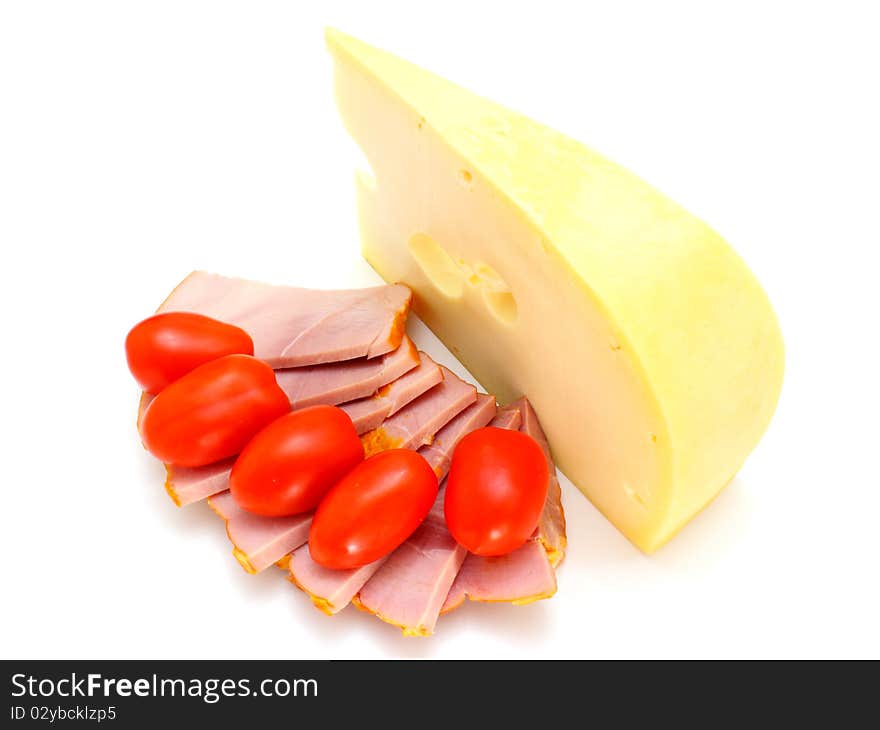 Cheese With Holes And Red Tomatoes