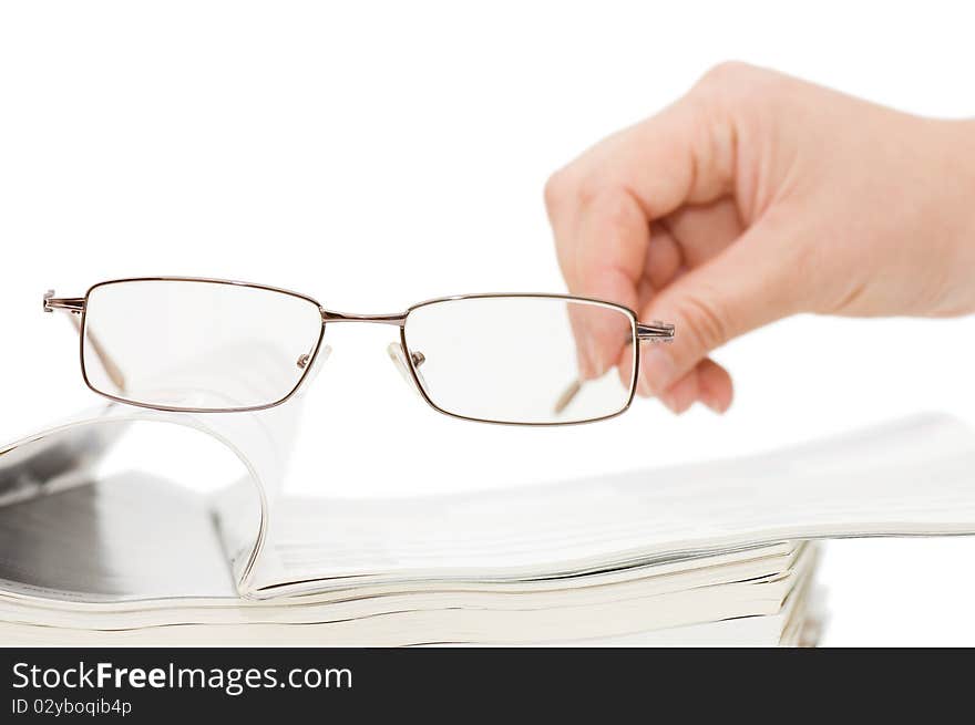 Magazine and spectacles isolated