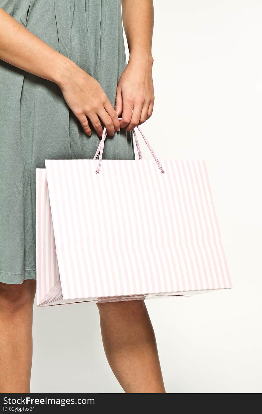 Brunette woman with shoppingbag smiling