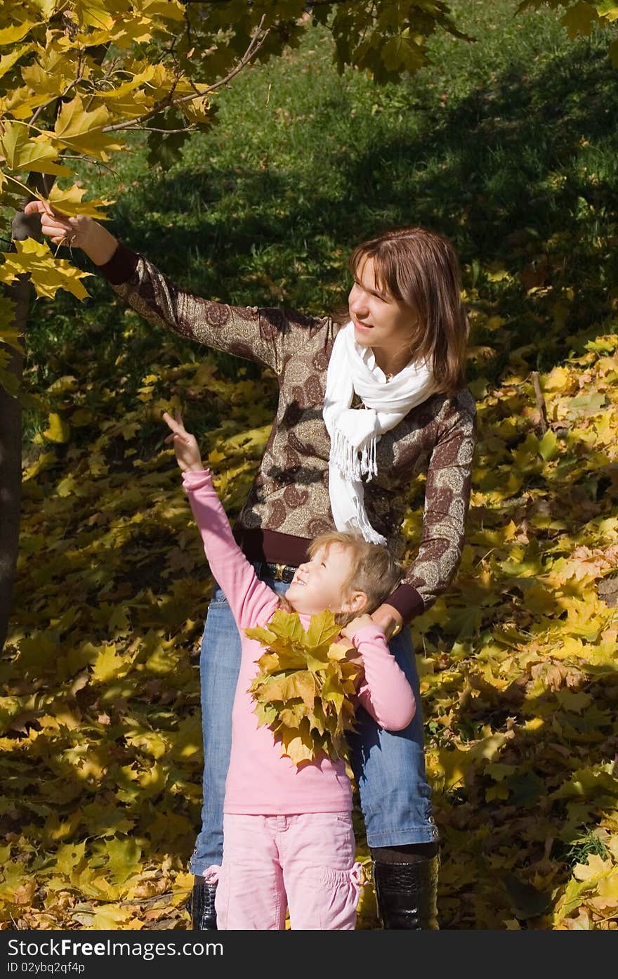 Happy family in autumn park