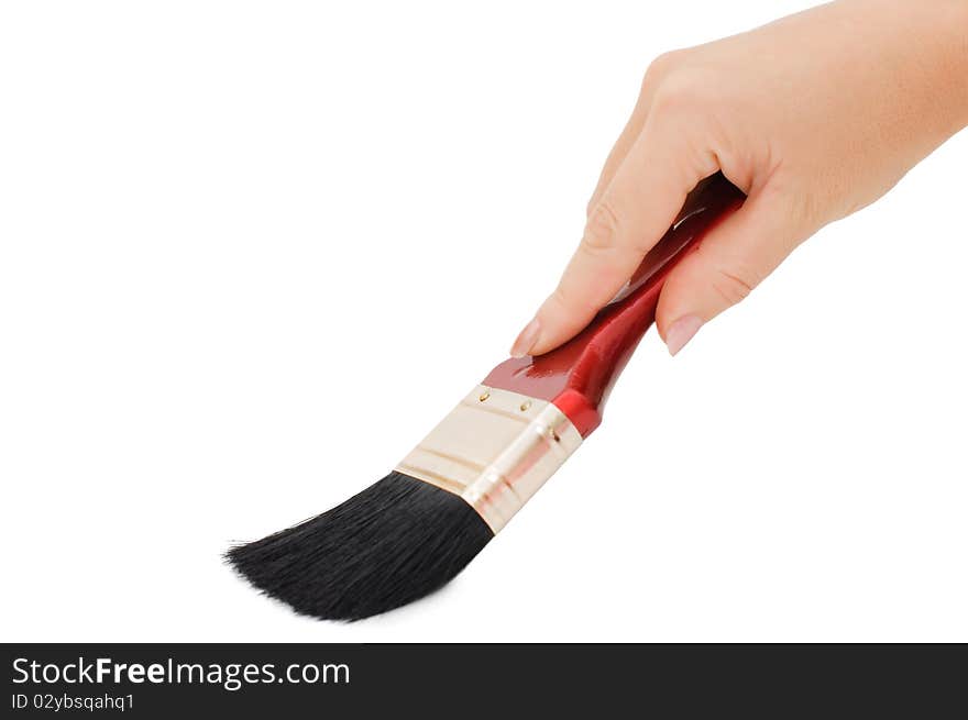 Hand with brush isolated over white