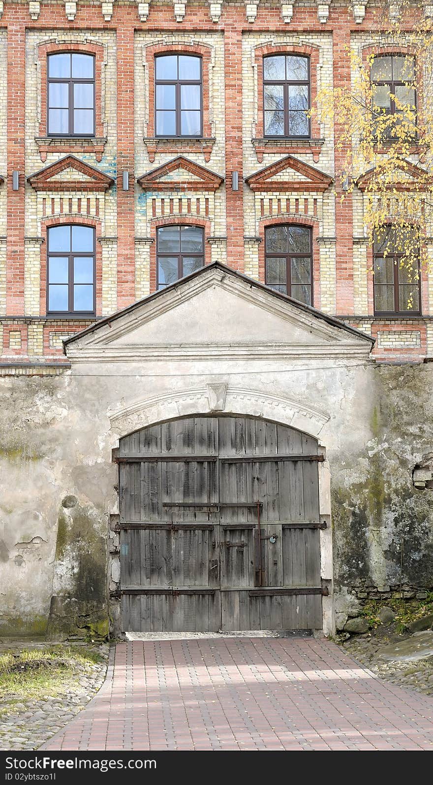 Ancient wooden gate at orthodox monastery in Vilnius. On a background ancient house