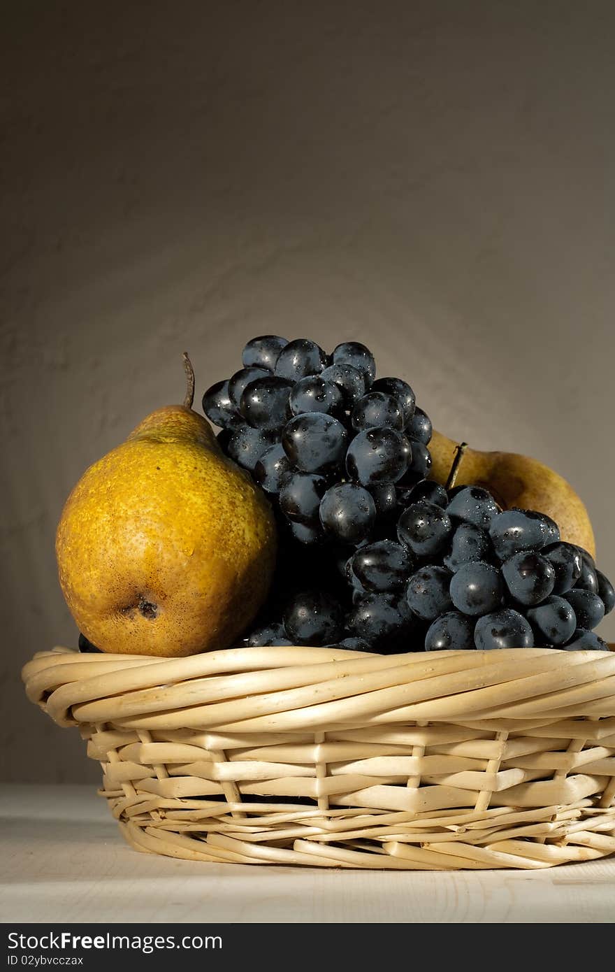 Fresh tasty fruit in the bast basket