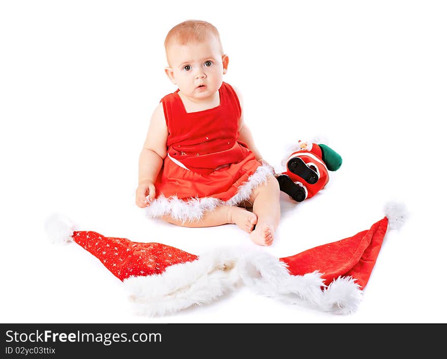 Baby in Santa Claus hat on white background