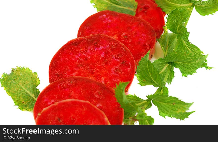 Cactaceous fig cuting with mint brunch isolated on white background. Cactaceous fig cuting with mint brunch isolated on white background