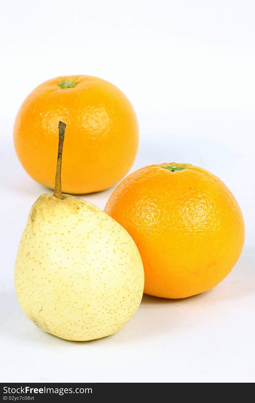 pears and oranges isolated on a white background