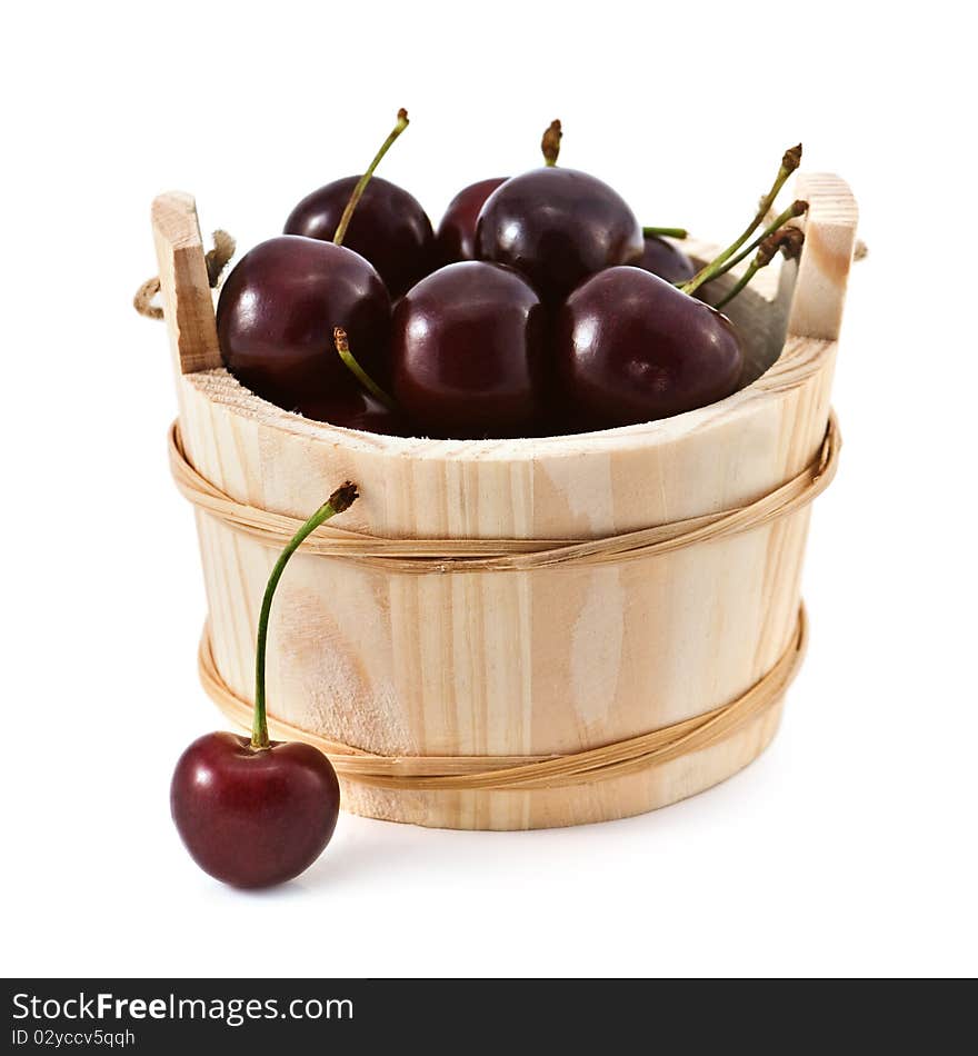 Cherry in basket isolated on white