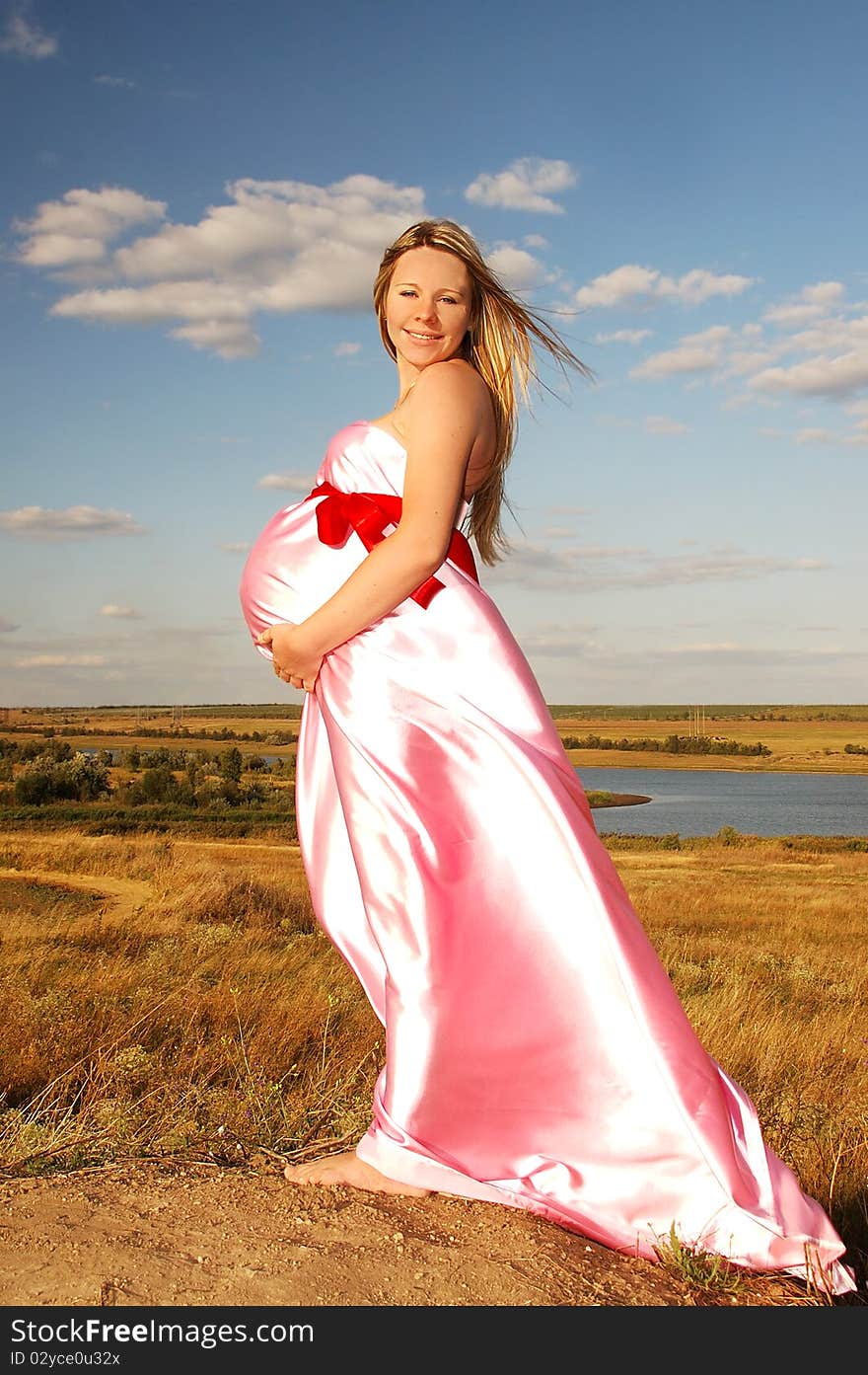 Beautiful, happy pregnant girl in nature. Beautiful, happy pregnant girl in nature