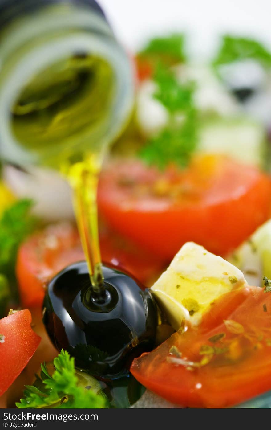 Olive oil in salad closeup