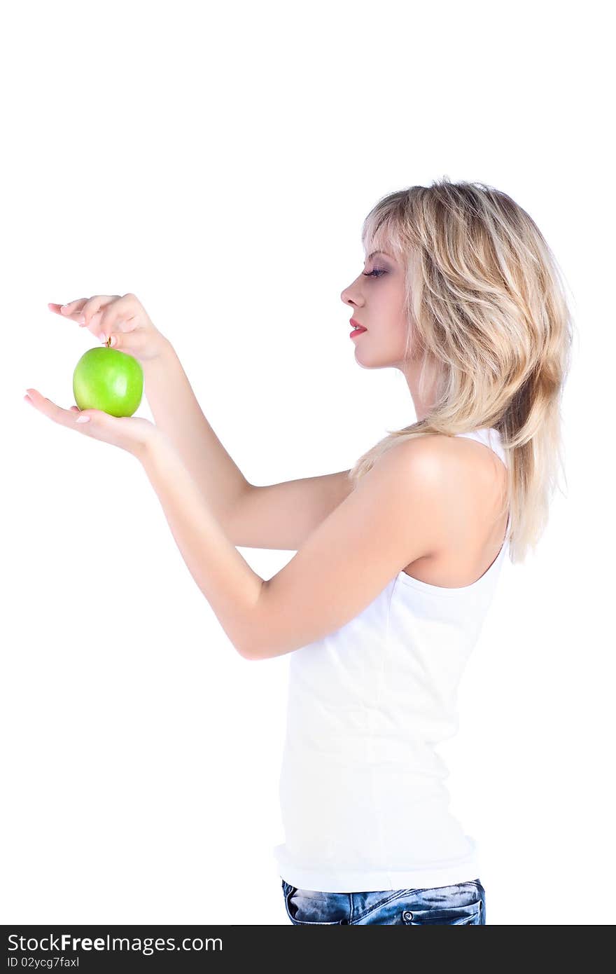 Young girl over white background with apple. Young girl over white background with apple