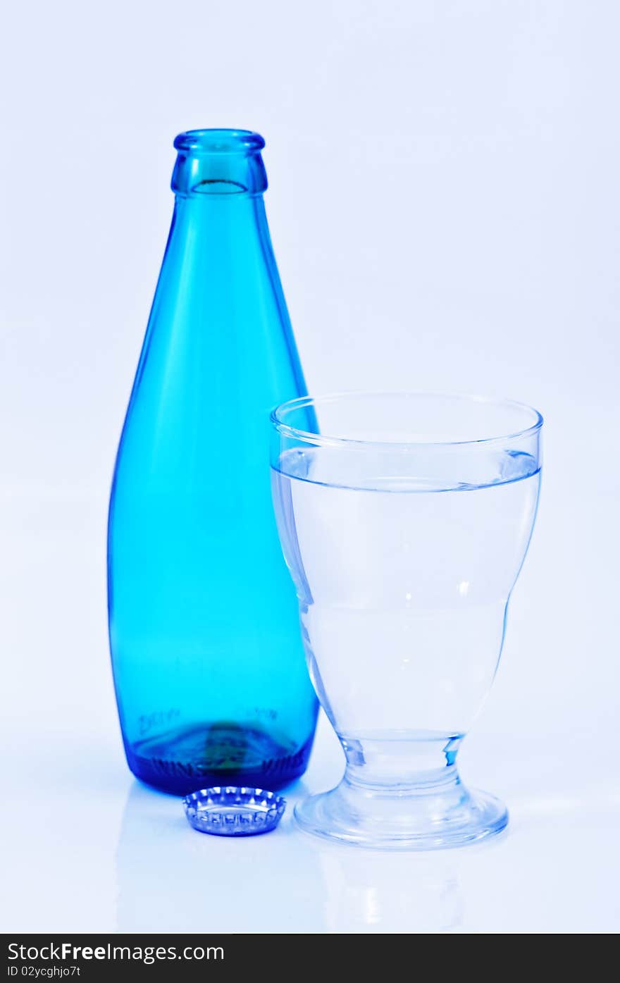 Glass of water with bottle