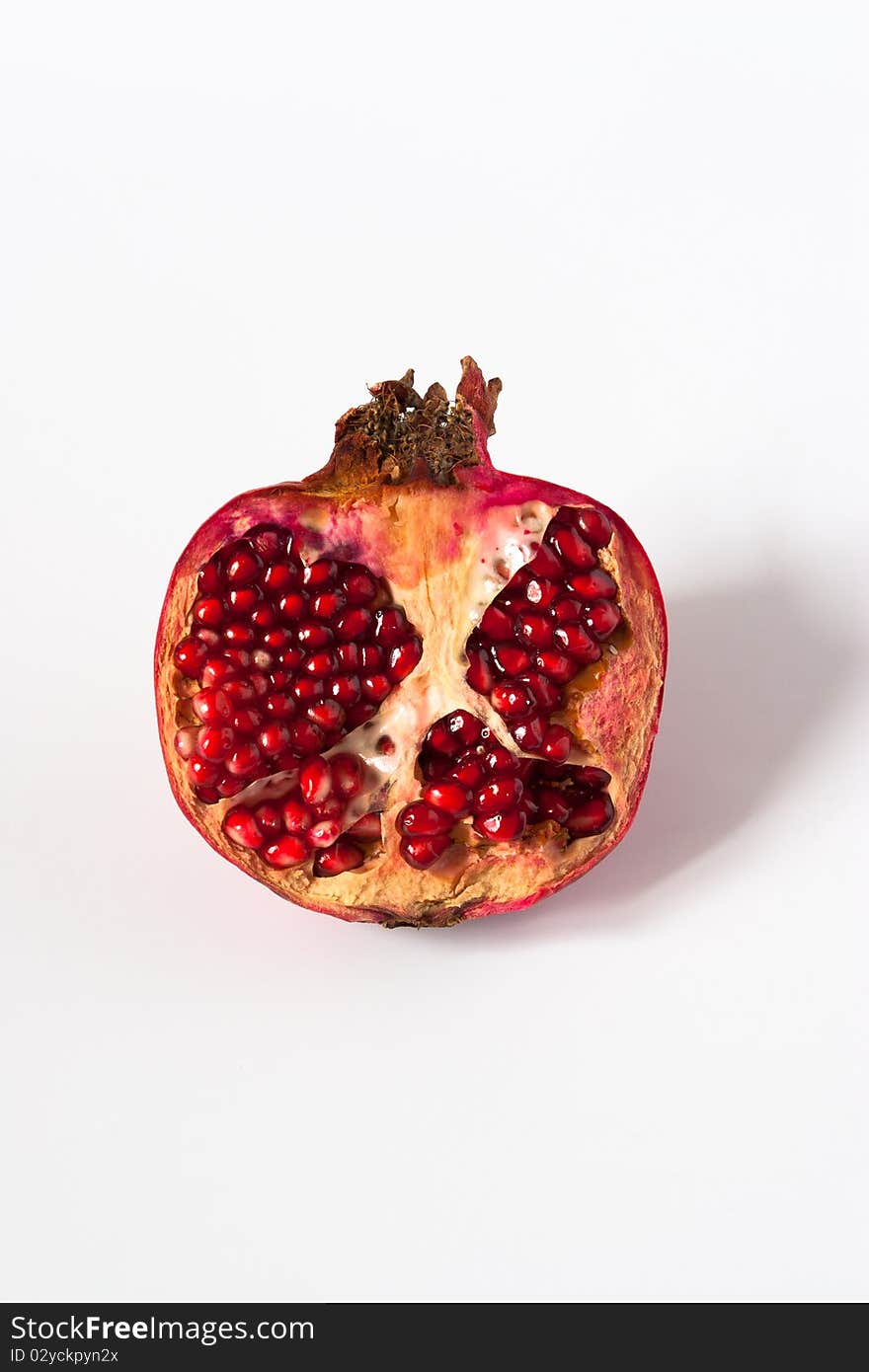 Ripe red pomegranate split into parts. Ripe red pomegranate split into parts