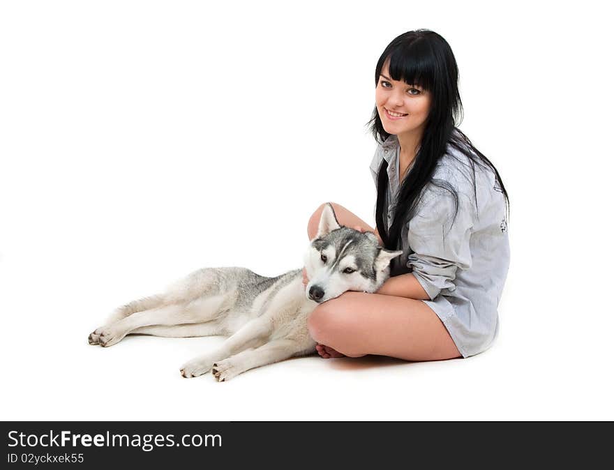 Cute girl with grey siberian husky isolated on white