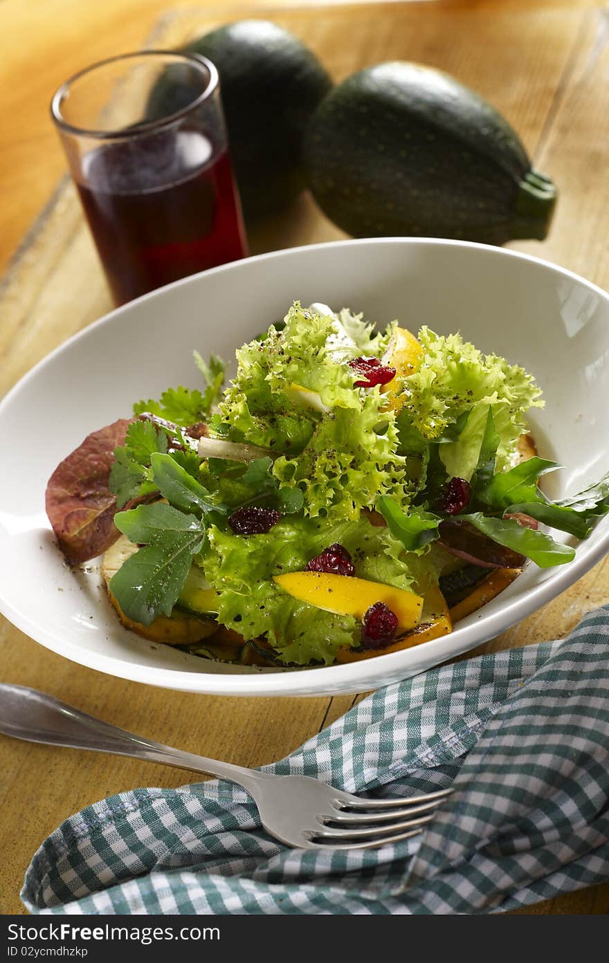 Green salad with different sort of pumpkin