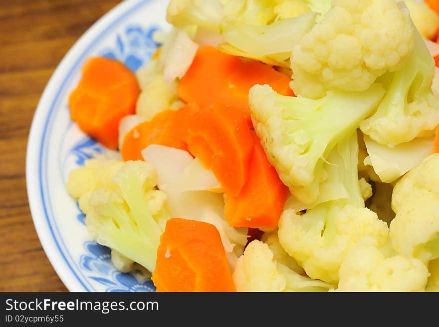 Simple white cauliflower cuisine cooked with carrots Oriental style.