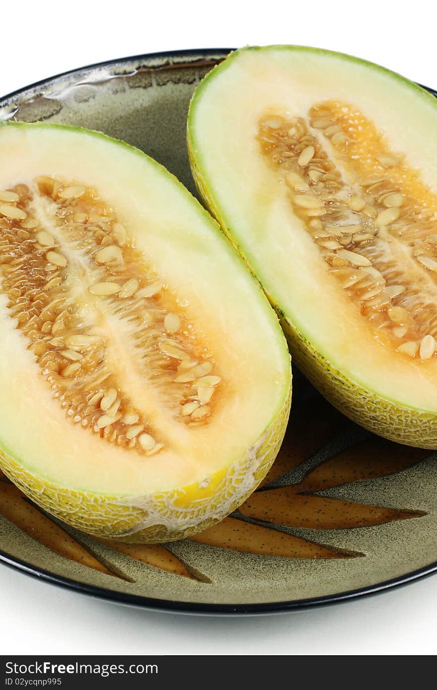 A plate of cantaloupe on a white background. A plate of cantaloupe on a white background