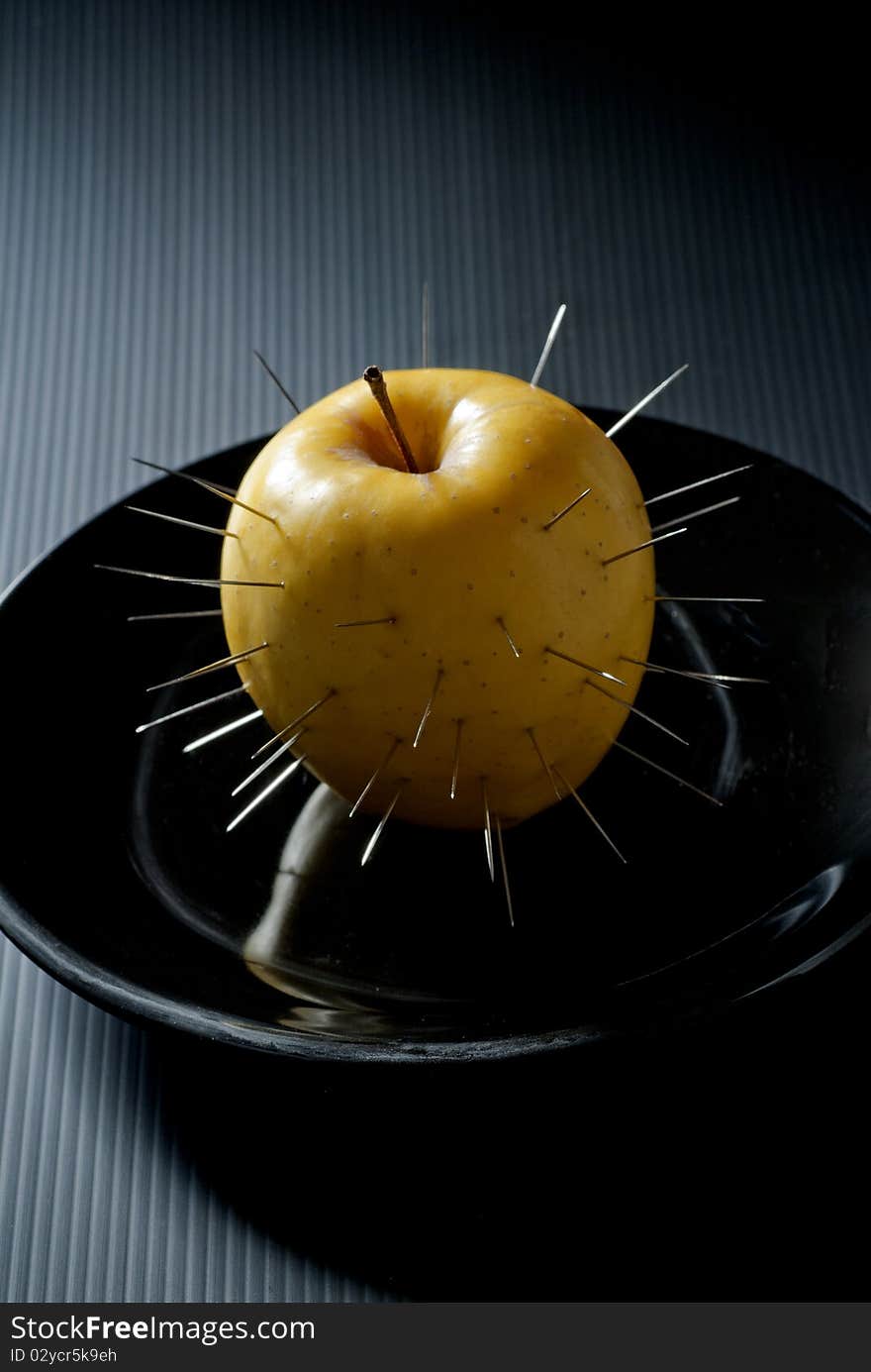 prickly apple in a dish of black ceramic