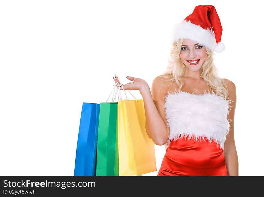 Beauty girl in santa hat with color bag