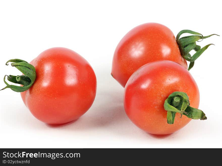 Red fresh tomato on isolated white background