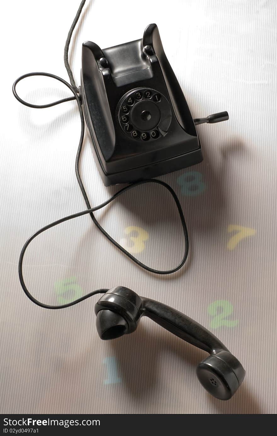 Old black telephone on a table