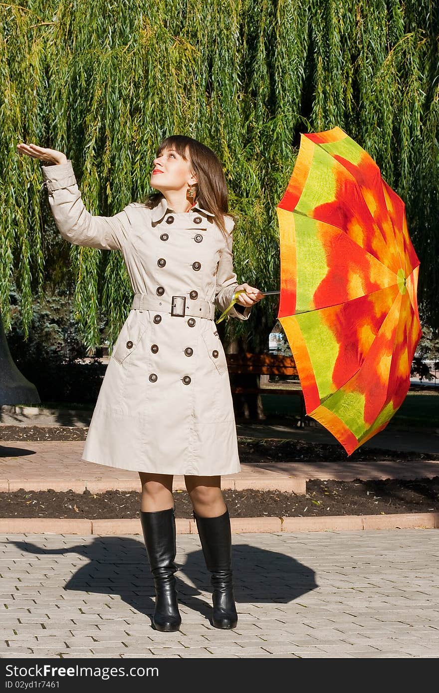 Young beauty woman with colorful umbrella. Young beauty woman with colorful umbrella