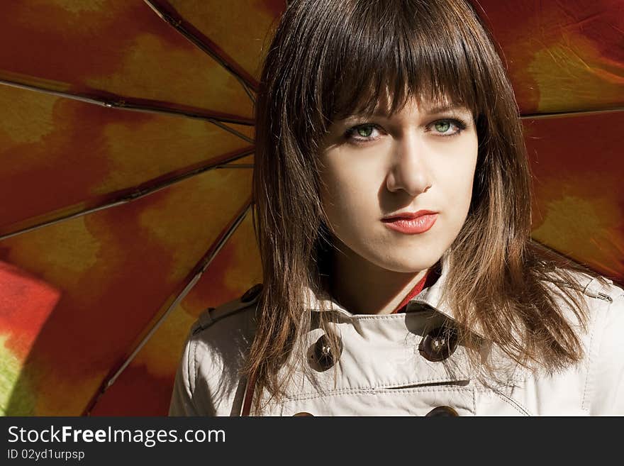 Portrait of beauty young woman with umbrella