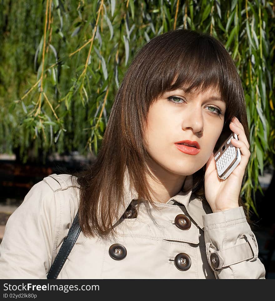 Portrait of beauty woman with white phone