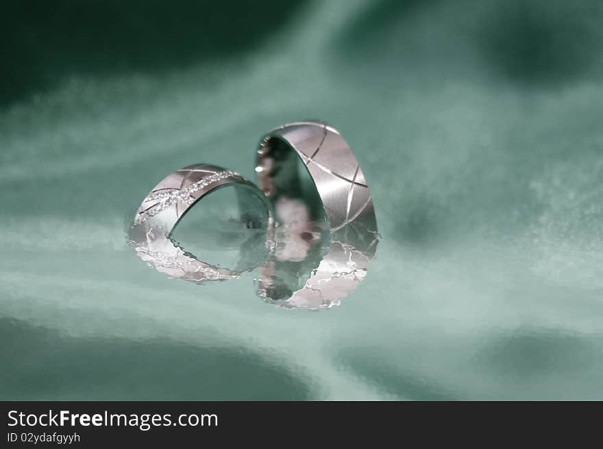 Wedding rings on greyscale background