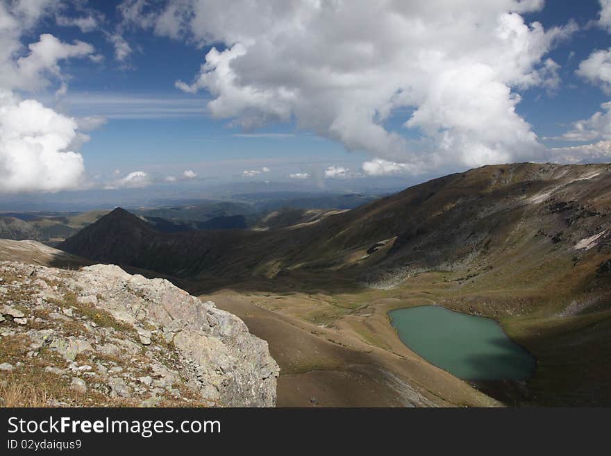 Mountain lake photographed from ridge top. Russia, Caucasus. Mountain lake photographed from ridge top. Russia, Caucasus