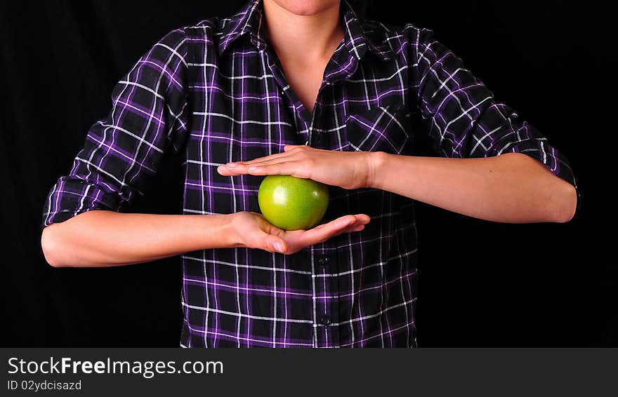 Woman holding a green apple