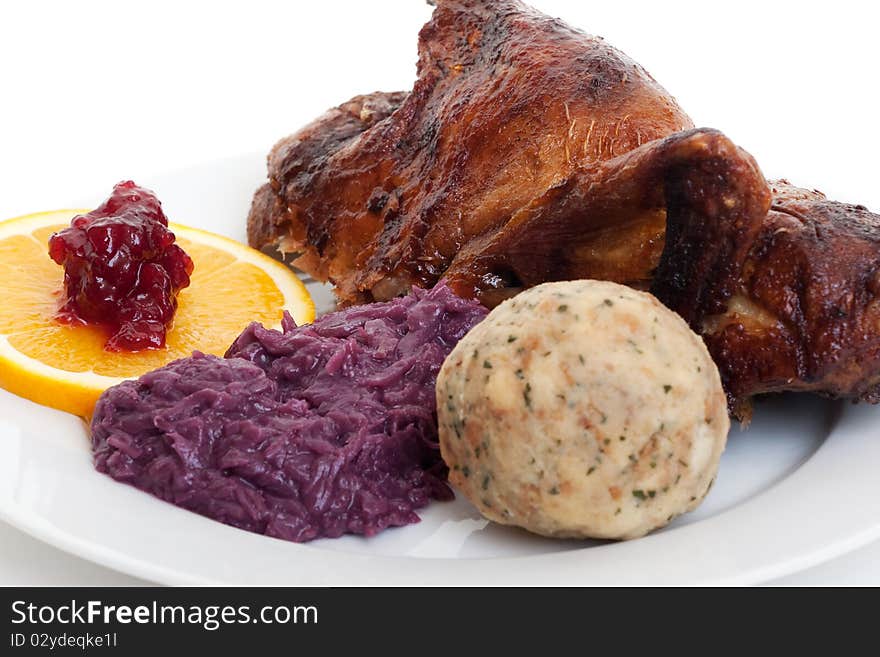 Roasted duck, festive food with dumpling and red cabbage