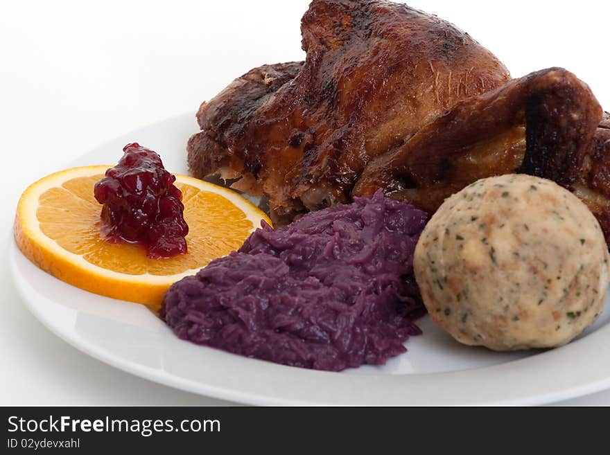 Roasted duck, festive food with dumpling and red cabbage