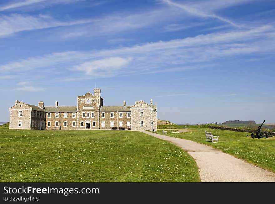 Footpath to castle under blue sky and cloud