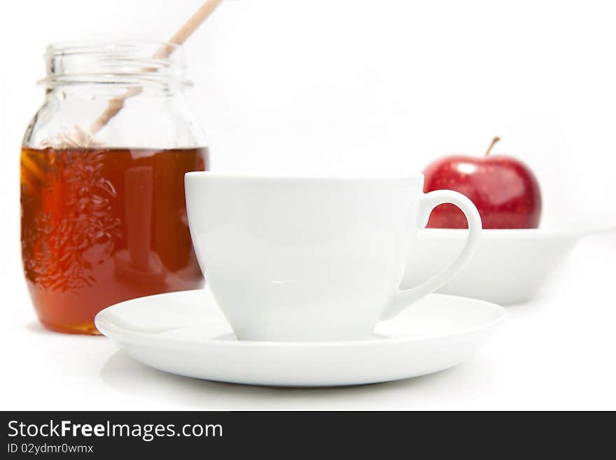 Breakfast with milk, honey and apple on the white background