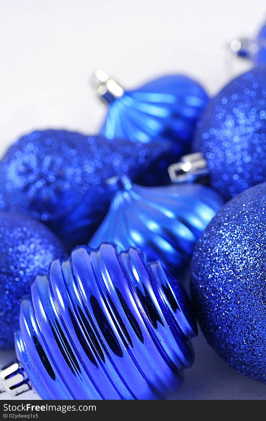 Close up of blue bulbs on white.