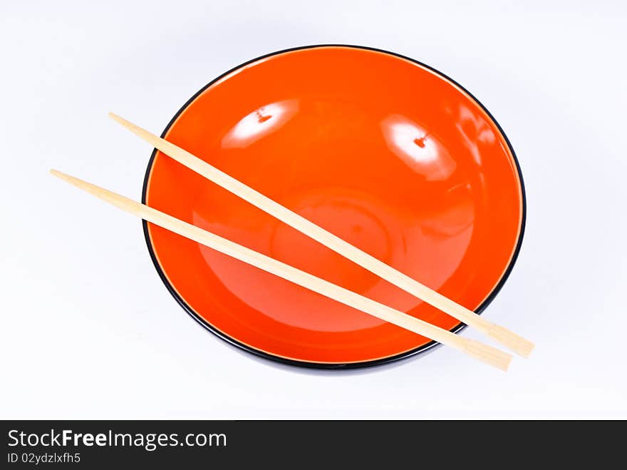 Orange dish with sticks