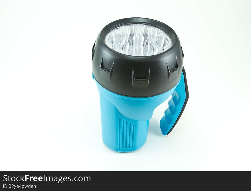 Blue flashlight on a white background