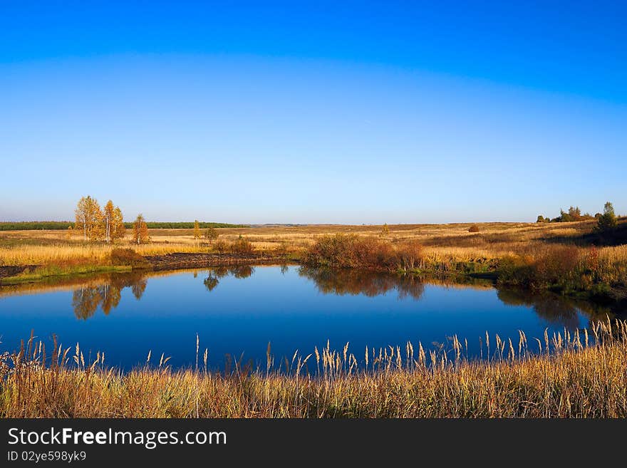 Small lake on a flat landscape. Small lake on a flat landscape