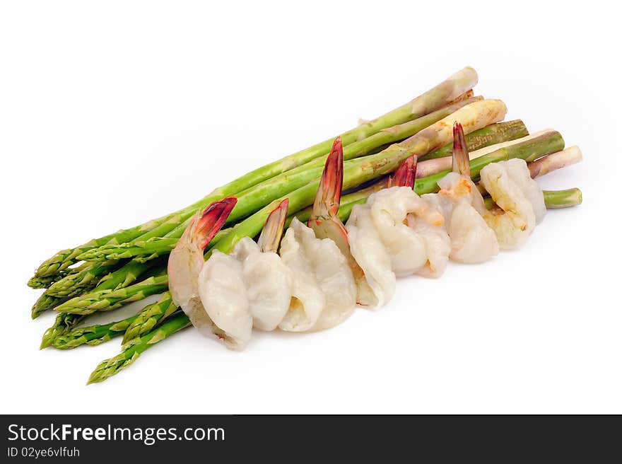 Green Asparagus and shrimp on white.