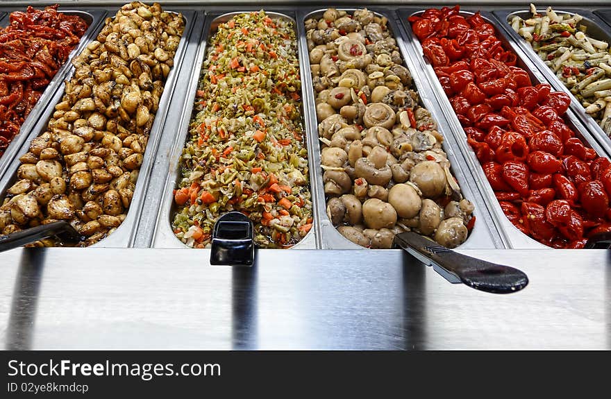 Assortment of various relishes at a deli market. Assortment of various relishes at a deli market