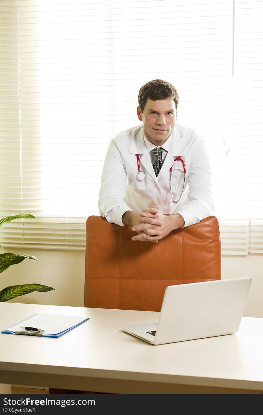 Portrait of a male doctor in his studio