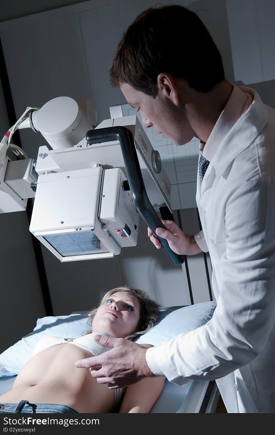 Young woman receiving x-ray scan. Young woman receiving x-ray scan