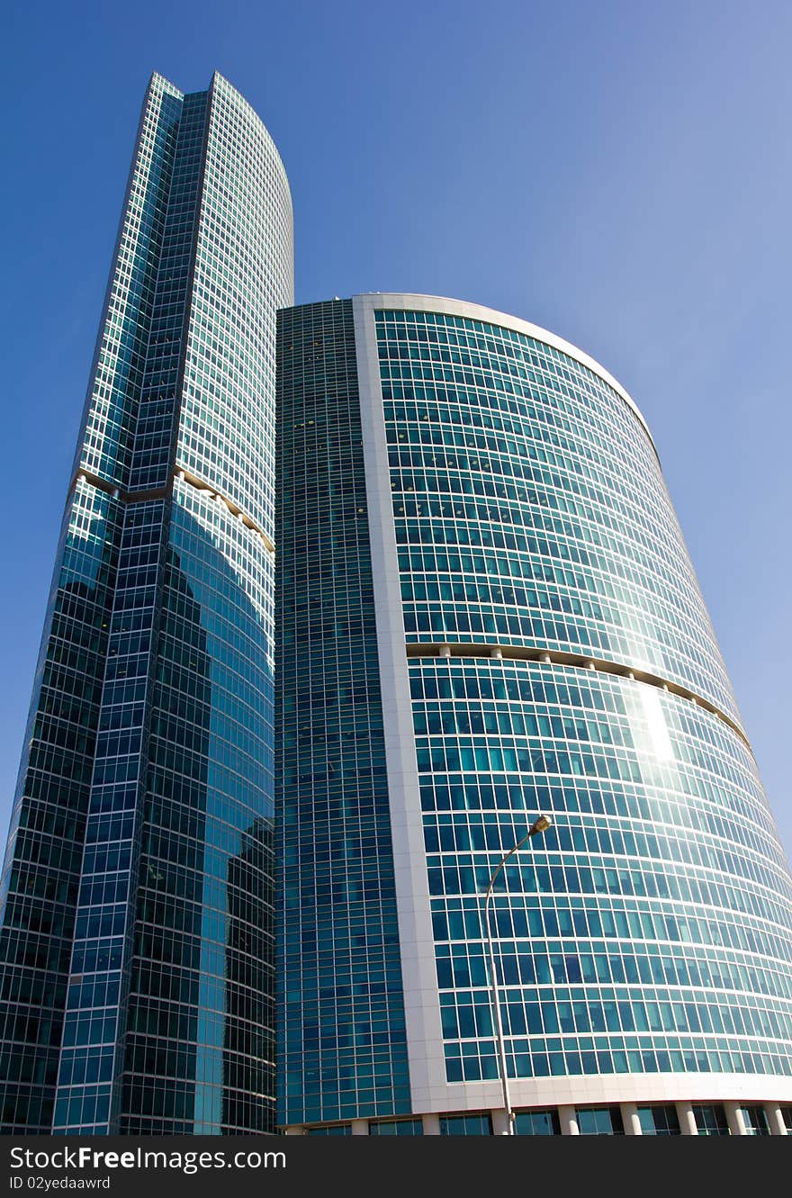 Business office building against the blue sky without clouds