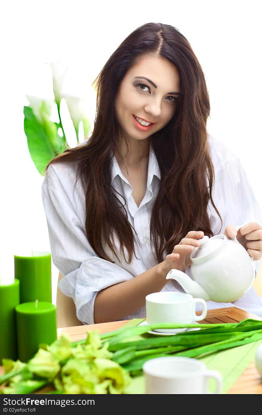 Beautiful woman  in cafe over white background with flowers