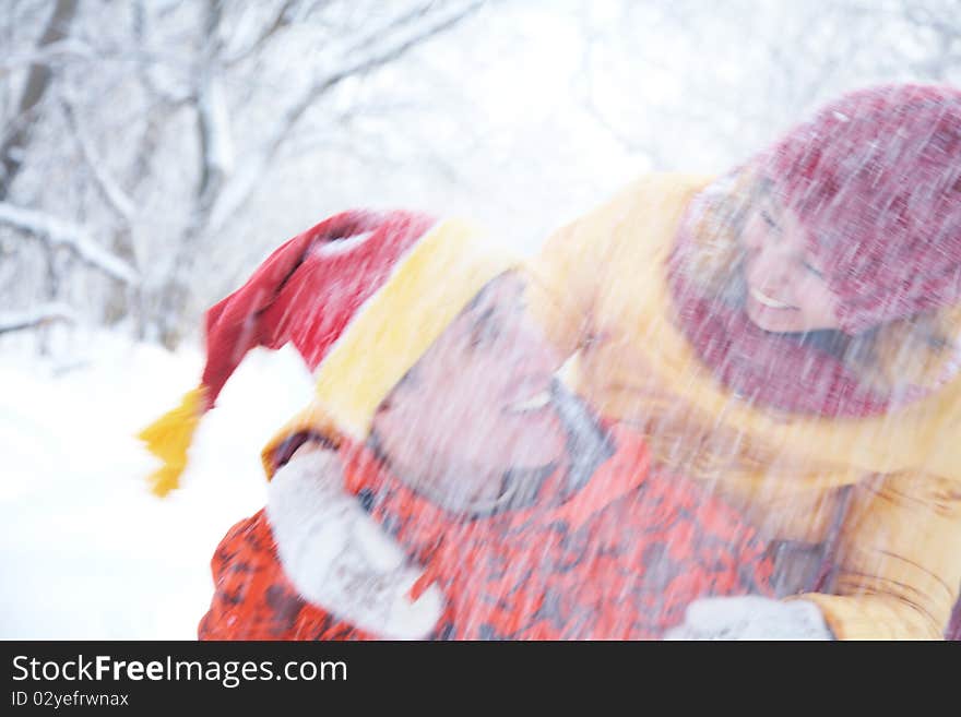 Couple playing on snow