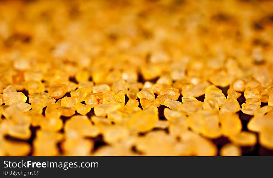 Bath salts with orange extract on a black background. Macro photography. Bath salts with orange extract on a black background. Macro photography.