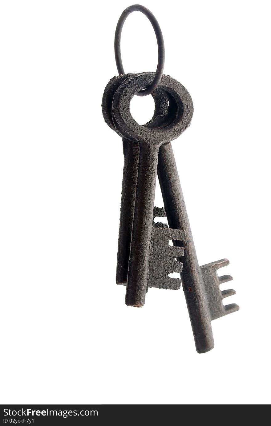 Three old fashinoed keys on a ring isolated. Red highlight